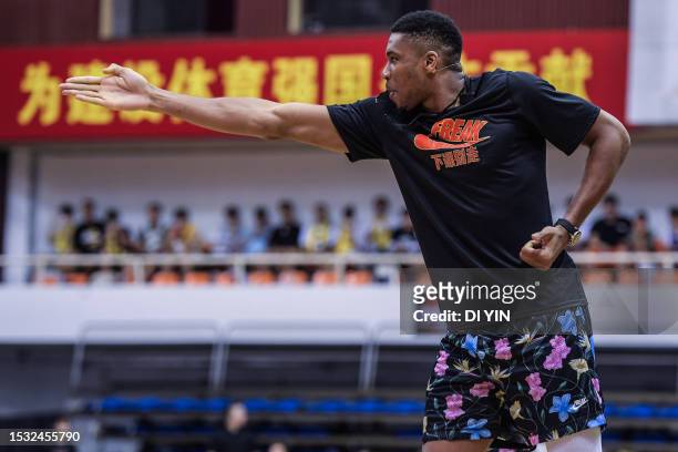 Giannis Antetokounmpo calls the game as a referee during the game as part of a promotional event during his visit to China at Beijing Sport...