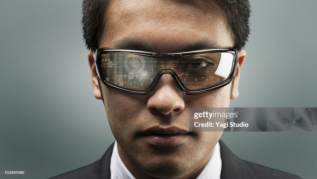 The man wearing futuristic glasses