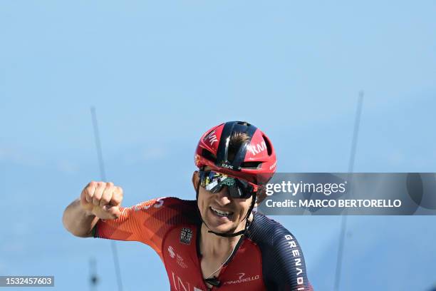 Grenadiers' Polish rider Michal Kwiatkowski cycles to the finish line to win the 13th stage of the 110th edition of the Tour de France cycling race,...