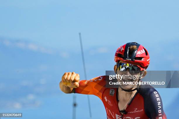 Grenadiers' Polish rider Michal Kwiatkowski cycles to the finish line to win the 13th stage of the 110th edition of the Tour de France cycling race,...