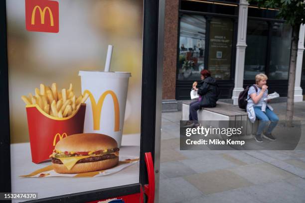 McDonalds double cheeseburger saver meal deal menu beef burger advertising poster on 6th July 2023 in London, United Kingdom.