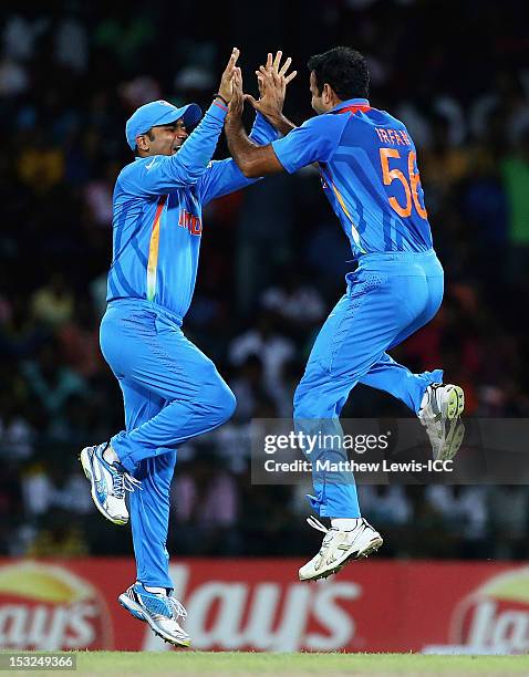 Irfan Pathan and Virender Sehwag of India celebrate the wicket of Jacques Kallis of South Africa during the ICC World Twenty20 2012 Super Eights...