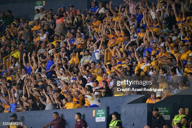 Fans of Tigres cheer the team during the Campeon de Campeones match between Tigres UANL and America as part of the Liga MX Femenil at Universitario...