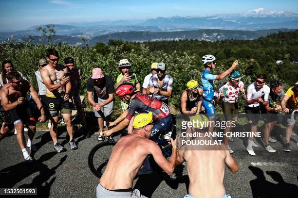 Grenadiers' Polish rider Michal Kwiatkowski cycles in the final ascent of Col du Grand Combier in the final kilometeres of the 13th stage of the...
