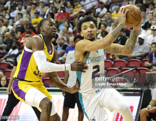 James Bouknight of the Charlotte Hornets drives against D'Moi Hodge of the Los Angeles Lakers in the first half of a 2023 NBA Summer League game at...
