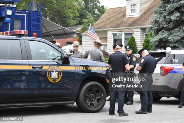 Personnel cordon-off the area after a suspect arrested in Gilgo Beach serial killings In Massapequa Park, Long Island, New York on July 14, 2023....