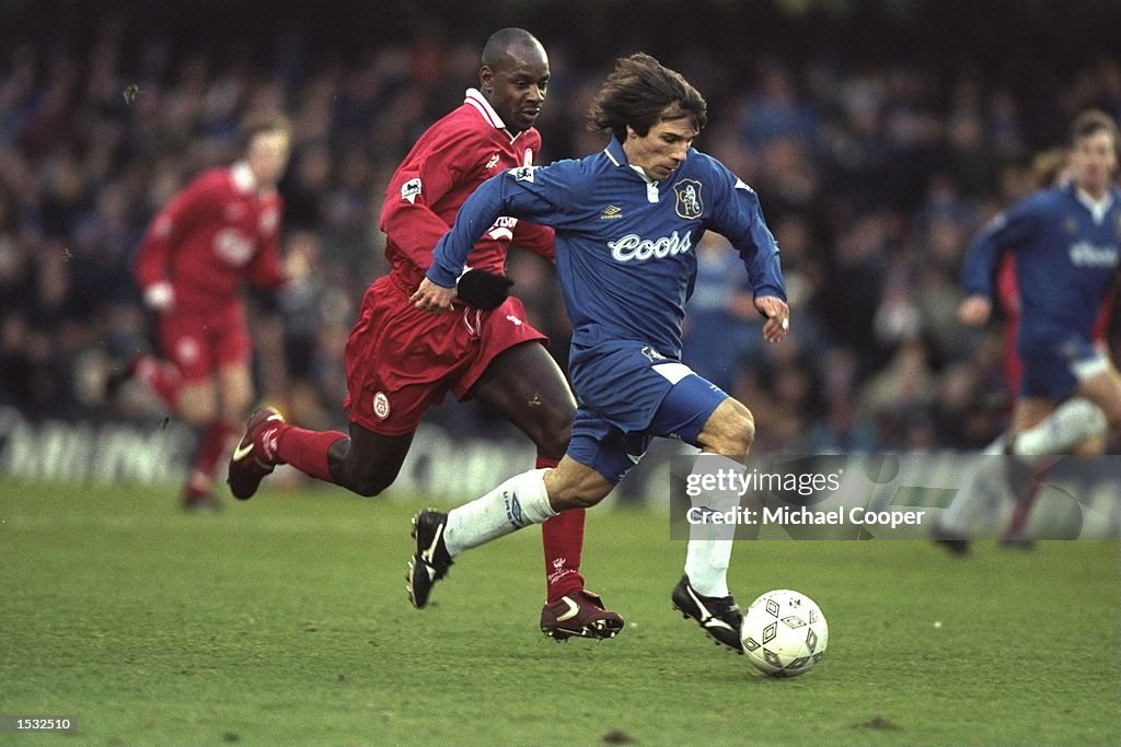 1 Jan 1997:  Gianfranco Zola of Italy and Chelsea is tracked by Michael Thomas of Liverpool during t