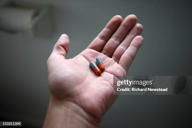 taking medicine - palm of hand stock pictures, royalty-free photos & images
