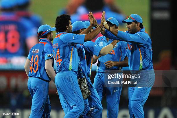 Zaheer Khan of India celebrates the wicket of Hashim Amla with teammates Yuvraj Singh, M S Dhoni and Suresh Raina during the ICC World Twenty20 2012...