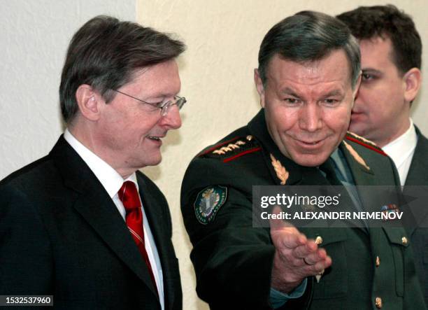 Austrian Chancellor Wolfgang Schuessel is welcomed by Russian Chief Military Prosecutor Mikhail Kislitsin during their meeting in Moscow, 28 January...