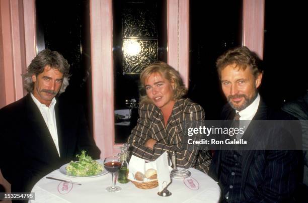 Actors Sam Elliott, Margaux Hemingway, and John Phillip Law on October 19, 1987 dining at Regine's Cafe Reginette in New York City, New York.