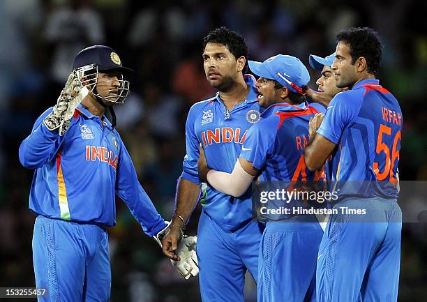 Indian Captain MS Dhoni and Yuvraj Singh,,Virat Kohli and Suresh Raina celebrate after the dismissal of Captain AB de Villiers during the ICC T20...