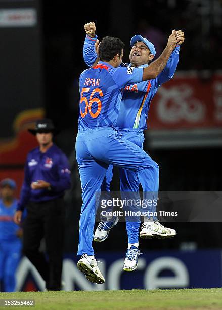 Indian players Irfan Pathan and Virender Sehwag celebrate after the dismissal of South African player Jacques Kallis during the ICC T20 World Cup...