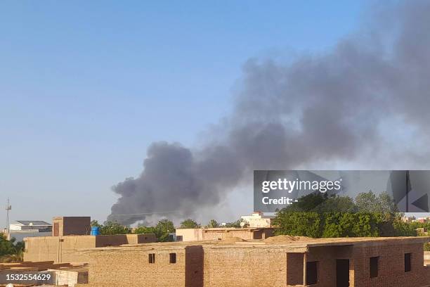 Smoke billows in the distance around the Khartoum Bahri district amid ongoing fighting on July 14, 2023. War-torn Sudan's capital experienced a...