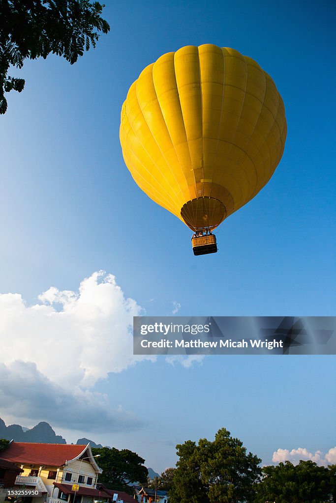 A hot air balloon floats away.