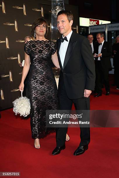Maybrit Illner and Rene Obermann arrive for the German TV Award 2012 at Coloneum on October 2, 2012 in Cologne, Germany.