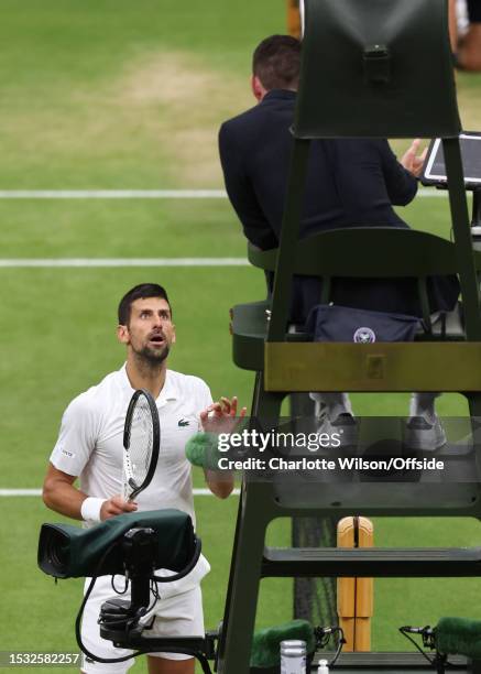 Novak Djokovic argues with the umpire during his Gentlemen's Singles Semi Finals match against Jannik Sinner during day twelve of The Championships...