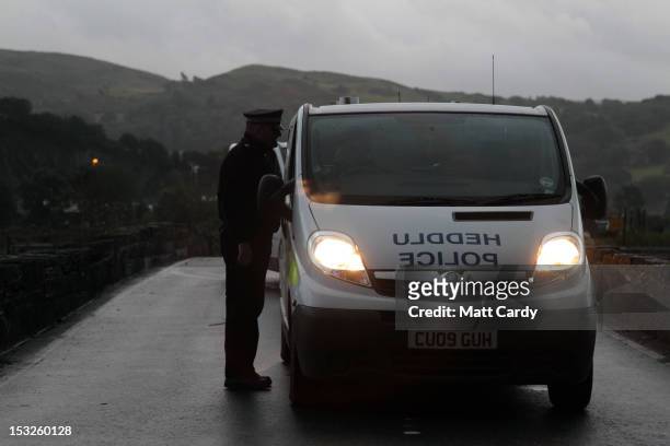 Police vehicles arrive to help in the search for April Jones at the junction of the A487 near Hoel Y Doll on October 2, 2012 near Machynlleth, Wales....