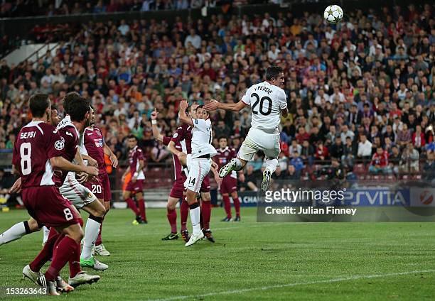 Robin van Persie of Manchester United scores a header to make it 1-0 during the UEFA Champions League Group H match between CFR 1907 Cluj and...