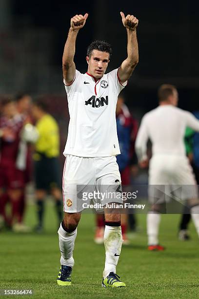 Robin van Persie of Manchester United thanks the support after the UEFA Champions League Group H match between CFR 1907 Cluj and Manchester United at...