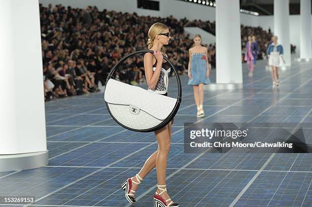 Models walk the runway at the Chanel Spring Summer 2013 fashion show during Paris Fashion Week on October 2, 2012 in Paris, France.