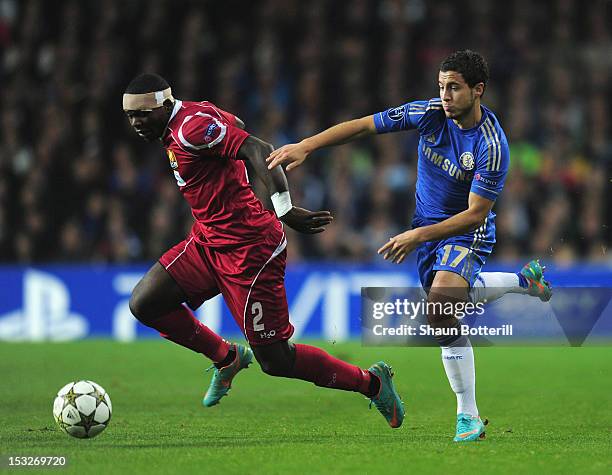 Jores Okore of FC Nordsjaelland and Eden Hazard of Chelsea challenge for the ball during the UEFA Champions League Group E match between FC...