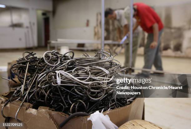 Hooks for hanging Chinese BBQ meat are packed into a box for buyers to pick up at Long Sing BBQ Sunday, July 30 in Houston. Long Sing BBQ, a...