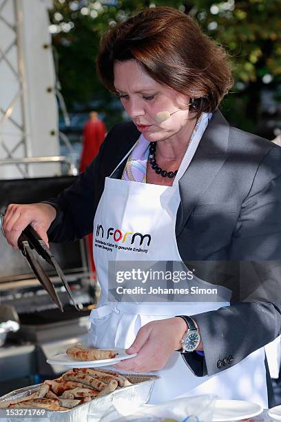 German Agriculture and Consumer Protection Minister Ilse Aigner samples regional food at the "Geschmackstage" 2012 regional food promotional event at...