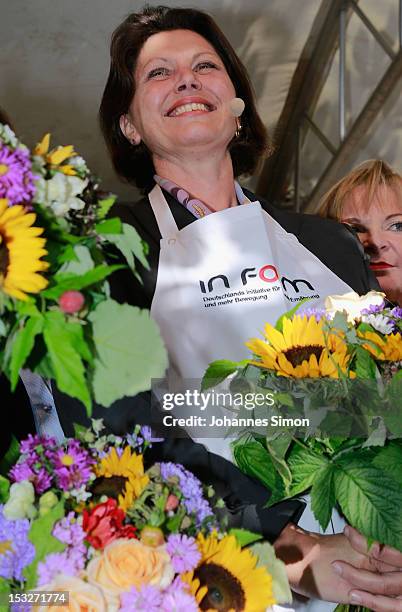 German Agriculture and Consumer Protection Minister Ilse Aigner samples regional food at the "Geschmackstage" 2012 regional food promotional event at...