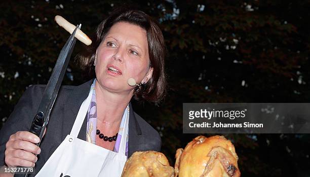 German Agriculture and Consumer Protection Minister Ilse Aigner samples regional food at the "Geschmackstage" 2012 regional food promotional event at...