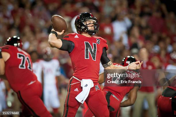 Quarterback Taylor Martinez of the Nebraska Cornhuskers throws against the Wisconsin Badgers defense during their game at Memorial Stadium on...