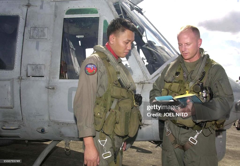 Air Force Rover Philippine Air Force officer 1st Lt. Rover Sobrino listens as US Air ...