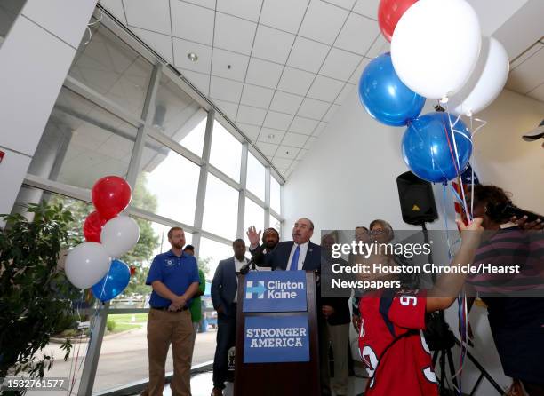 Ronald Reynolds plays with balloons during the grand opening of a Democratic National Committee headquarters for Hillary Clinton at the Dorothy...