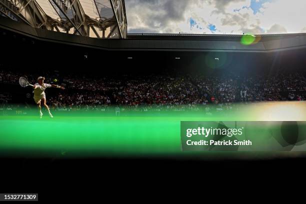 Jordan Thompson of Australia plays a forehand against Novak Djokovic of Serbia in the Men's Singles second round match during day three of The...