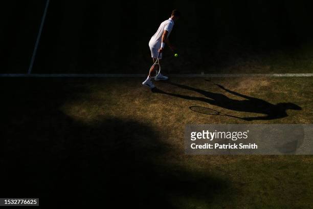 Joe Salisbury of Great Britain prepares to serve with partner Rajeev Ram of the United States against Tallon Griekspoor of Netherlands and Bart...