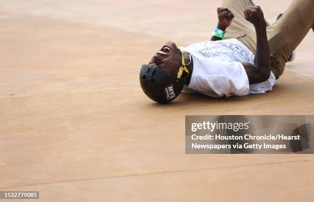 Skate It Up skateboard competition 18 Years and Older division finalist Earnest Teamer reacts to falling onto the ground and failing to perform his...