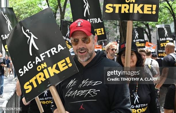 Actor Jason Sudeikis joins members of the Writers Guild of America and the Screen Actors Guild as they walk a picket line on Day 1 outside NBC...