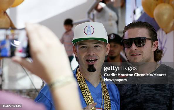 Paul Paper Rapper Rapper Paul Wall takes a photo with his fan at the grand opening of ...