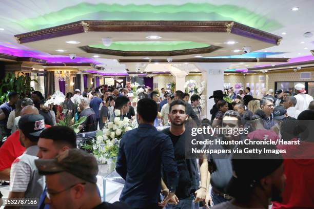 Hundreds of people participate the grand opening Paul Wall's grillz store, Johnny Dang & Co., Saturday, Oct. 22 in Houston.