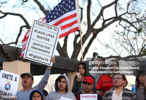 Jose Zuniga brings an American flag to participate the "Day Without Immigrants" protest at Guadalupe Plaza Thursday, Feb. 16 in Houston.