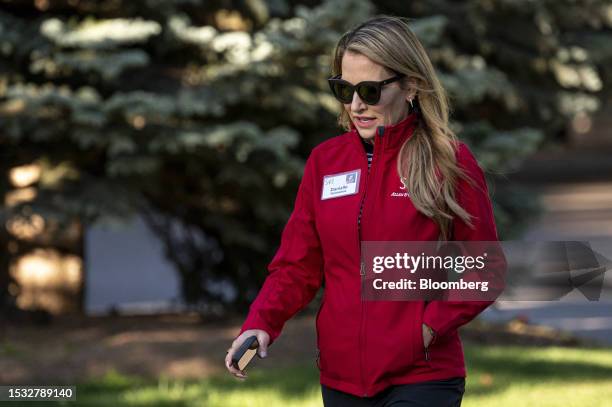 Danialle Karmanos, founder of Danialle Karmanos Work It Out , walks to the morning session during the Allen & Co. Media and Technology Conference in...