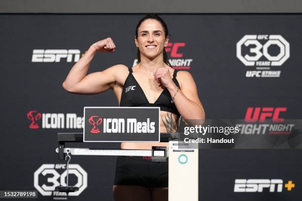 In this UFC handout, Norma Dumont of Brazil poses on the scale during the UFC Fight Night weigh-in at UFC APEX on July 14, 2023 in Las Vegas, Nevada.