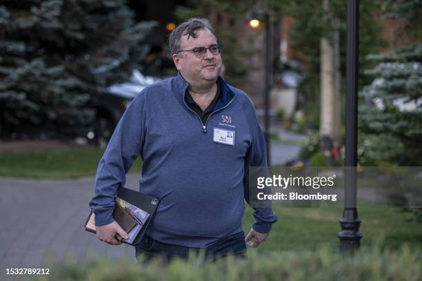 Reid Hoffman, co-founder of LinkedIn Corp., walks to the morning session during the Allen & Co. Media and Technology Conference in Sun Valley, Idaho,...