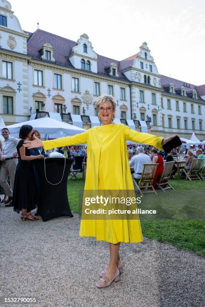 July 2023, Bavaria, Regensburg: Gloria Princess of Thurn and Taxis spreads her arms before the opening of the Thurn and Taxis Castle Festival in...