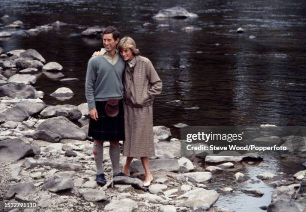 Prince Charles with his arm around his wife Princess Diana during a honeymoon photocall by the River Dee at the Balmoral Estate, Scotland on 19th...