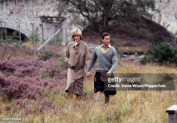Prince Charles with his arm around his wife Princess Diana during a honeymoon photocall by the River Dee at the Balmoral Estate, Scotland on 19th...