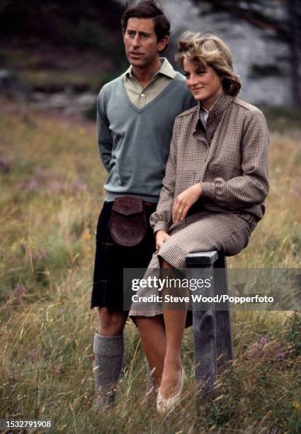 Prince Charles with his arm around his wife Princess Diana during a honeymoon photocall by the River Dee at the Balmoral Estate, Scotland on 19th...