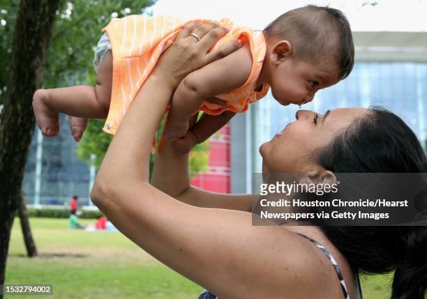 Priscila Rodriguez plays with her four-month-old son, Benjamin, at Discovery Green on the Mother's Day Sunday, May 14 in Houston. It was Benjamin's...