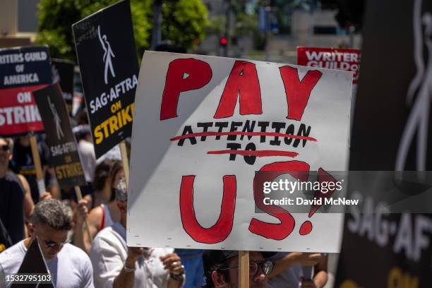 Members of the Hollywood actors SAG-AFTRA union walk a picket line with screenwriters outside of Paramount Studios on Day 2 of the actors' strike on...