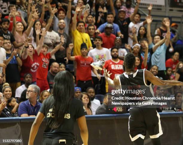 Houston Rockets star James Harden gives out signed and worn game shoes to the audience during the NBA game of hi charity basketball tournament...